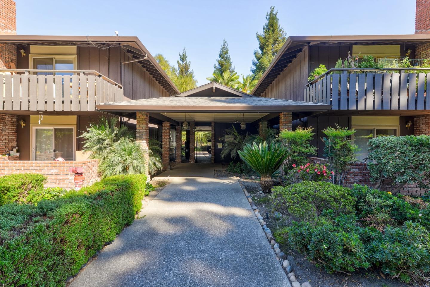 100 East Middlefield Road, Unit 1B Mountain View, CA 94043 - Photo 14 of 18 a front view of a house with garden