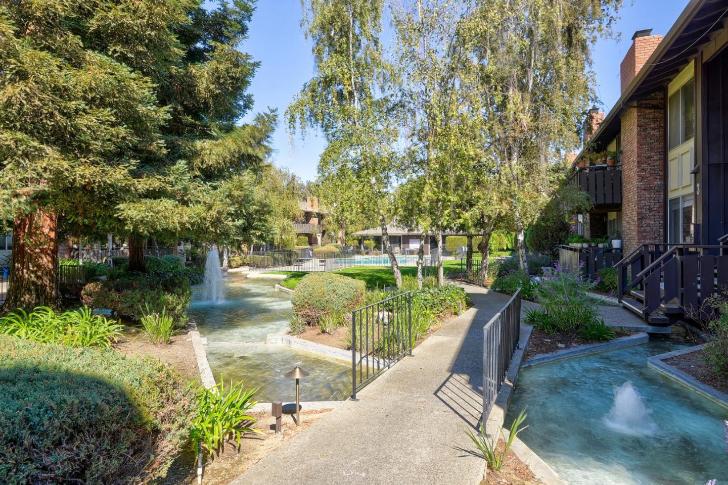 100 East Middlefield Road, Unit 1B Mountain View, CA 94043 - Photo 15 of 18 a view of a lake with a house