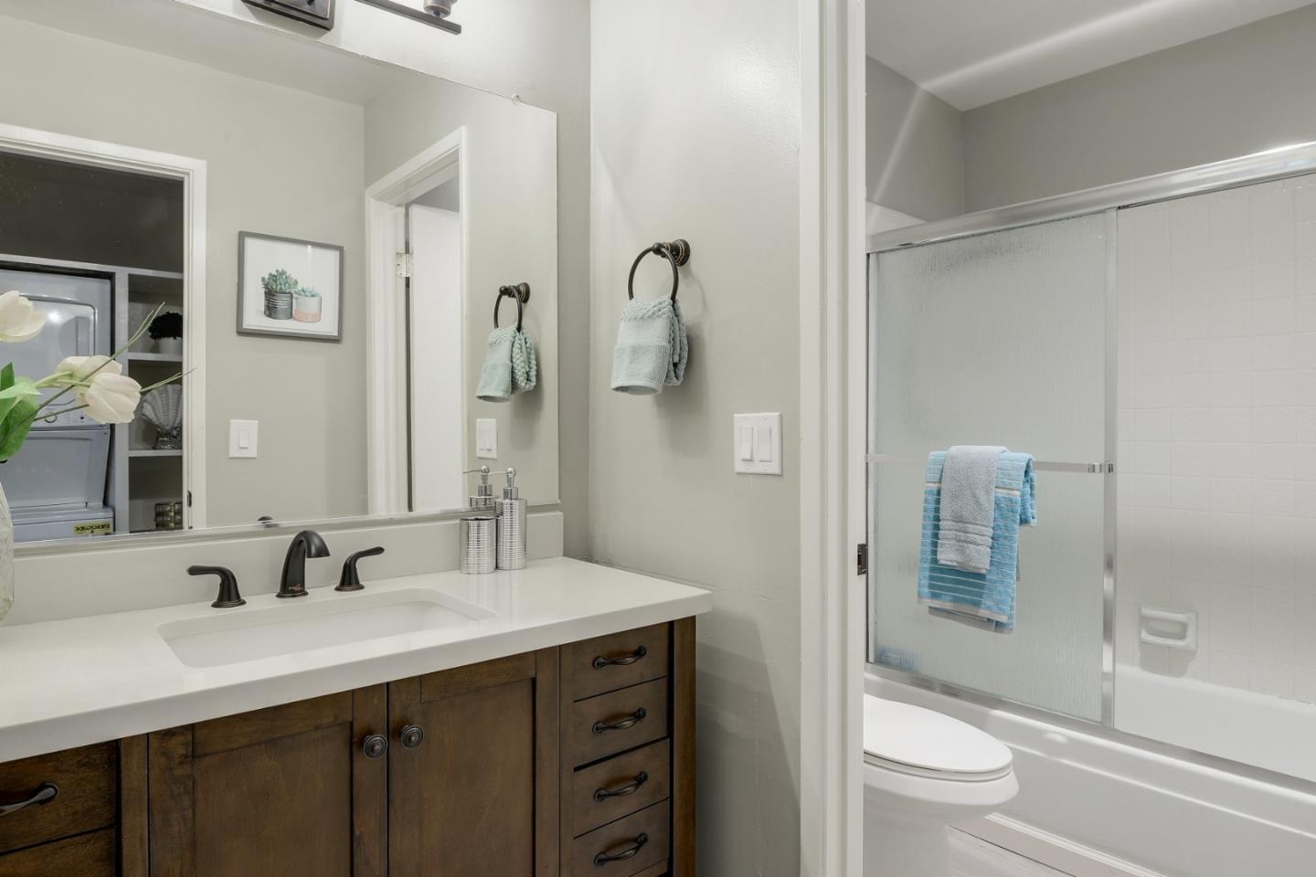 100 East Middlefield Road, Unit 1B Mountain View, CA 94043 - Photo 9 of 18 a bathroom with a sink a toilet and shower