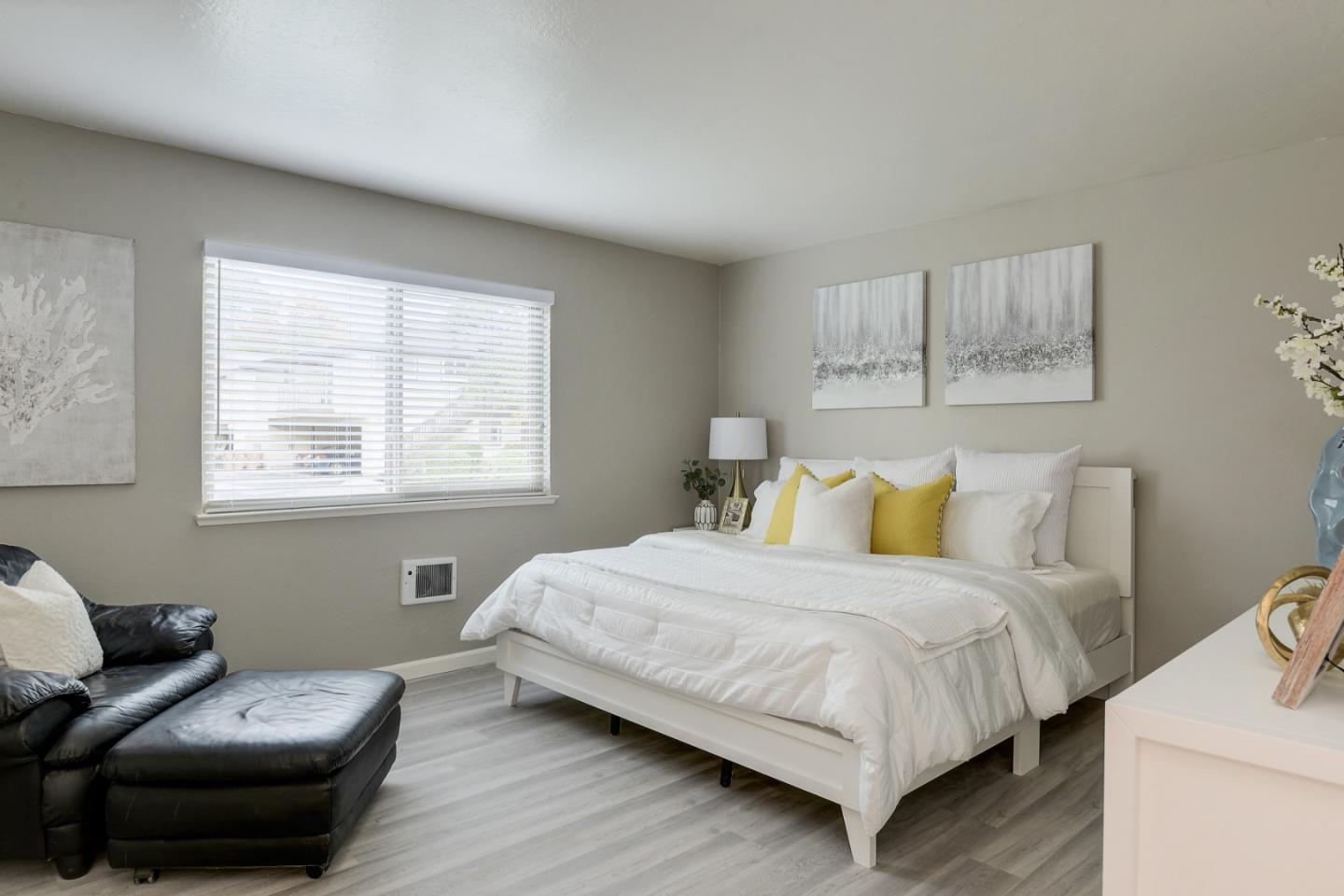 100 East Middlefield Road, Unit 1B Mountain View, CA 94043 - Photo 10 of 18 a bedroom with a bed and a couch