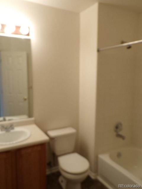 9934 Sydney Lane Highlands Ranch, CO 80130 - Photo 11 of 19 a white toilet sitting next to a bath tub