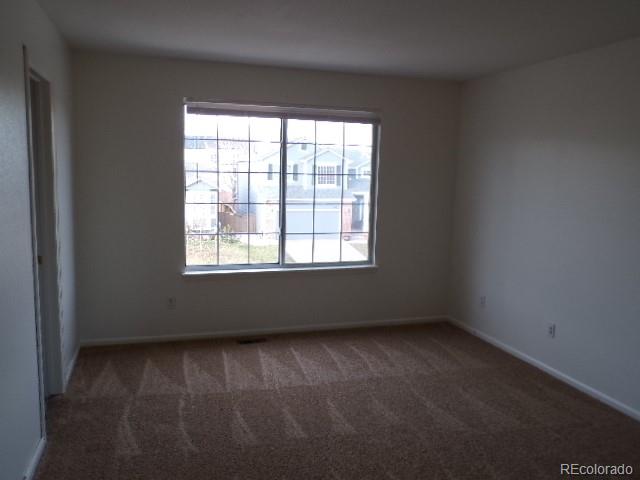 9934 Sydney Lane Highlands Ranch, CO 80130 - Photo 12 of 19 an empty room with a window