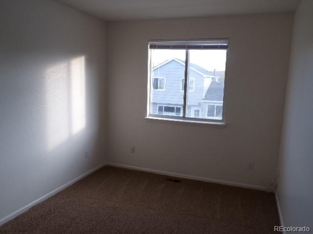9934 Sydney Lane Highlands Ranch, CO 80130 - Photo 16 of 19 an empty room with a window