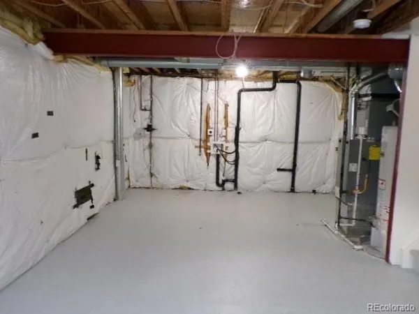 a view of water heater room with hallway