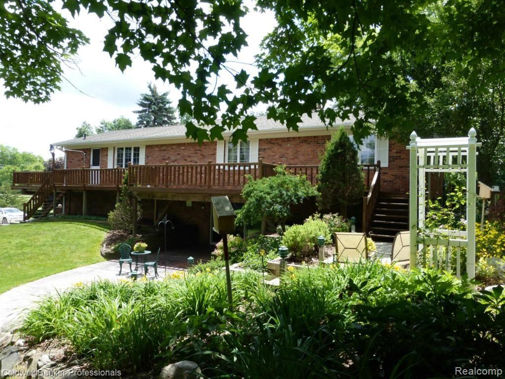 7680 Oakhill Road Clarkston, MI 48348 - Photo 2 of 32 back of home_06-27-2014.jpg