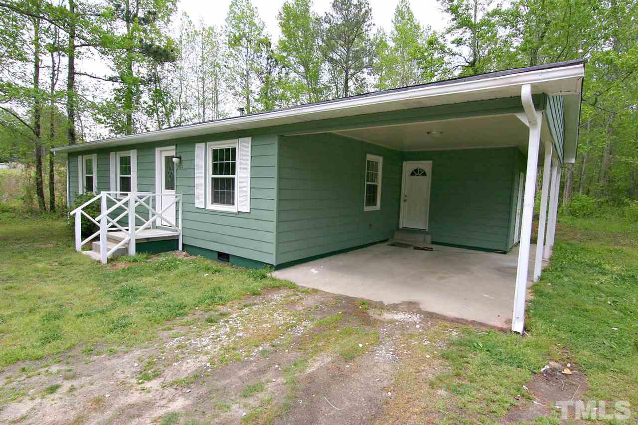 7033 Buck Road Wendell, NC 27591 - Photo 2 of 25 a front view of a house with garden