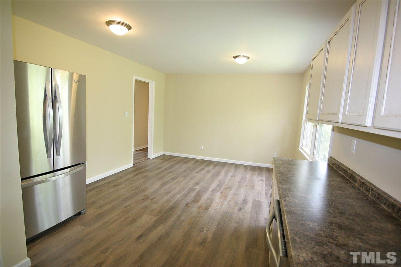 7033 Buck Road Wendell, NC 27591 - Photo 12 of 25 a view of a kitchen with a sink and refrigerator
