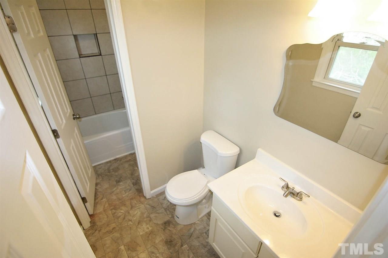 7033 Buck Road Wendell, NC 27591 - Photo 19 of 25 a bathroom with a sink and toilet