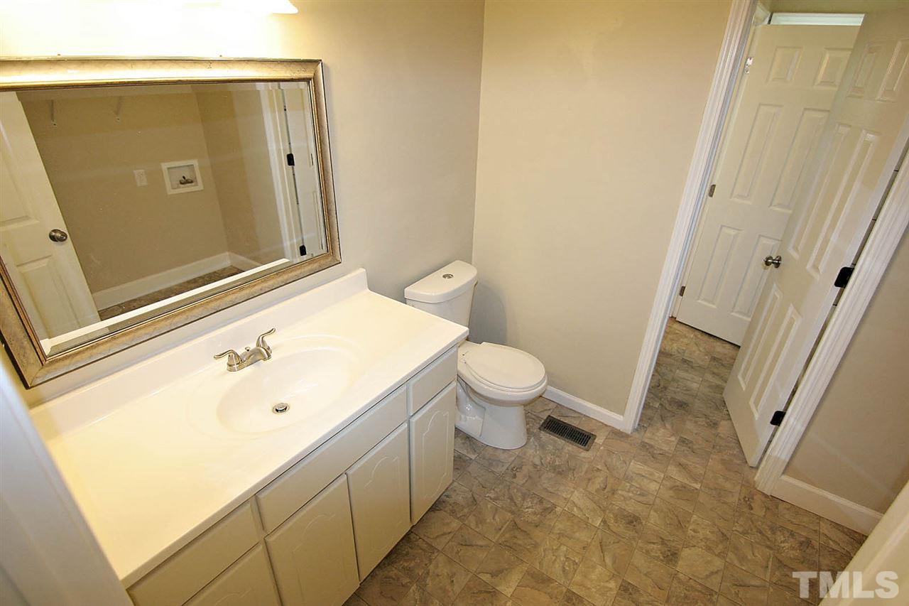 7033 Buck Road Wendell, NC 27591 - Photo 20 of 25 a bathroom with a sink and a toilet