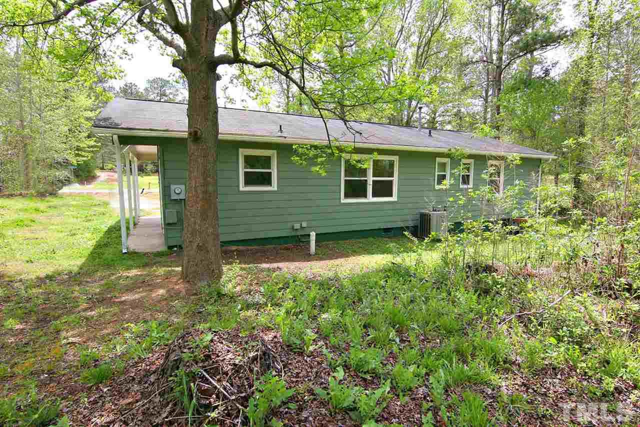 7033 Buck Road Wendell, NC 27591 - Photo 25 of 25 a front view of a house with garden