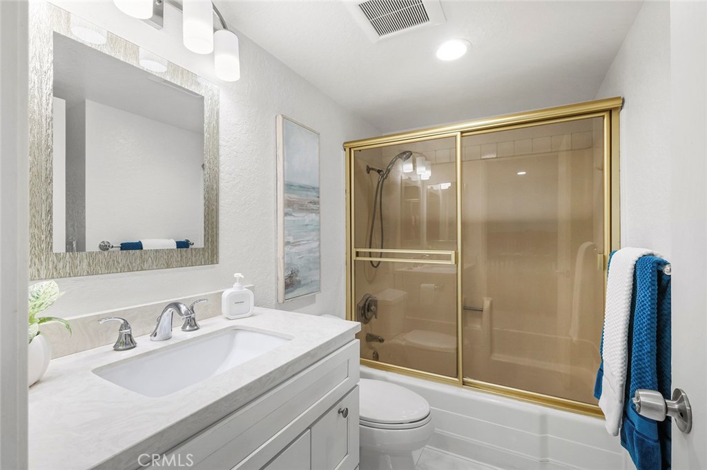 20702 El Toro Road, Unit 226 Lake Forest, CA 92630 - Photo 14 of 39 a bathroom with a sink toilet and shower