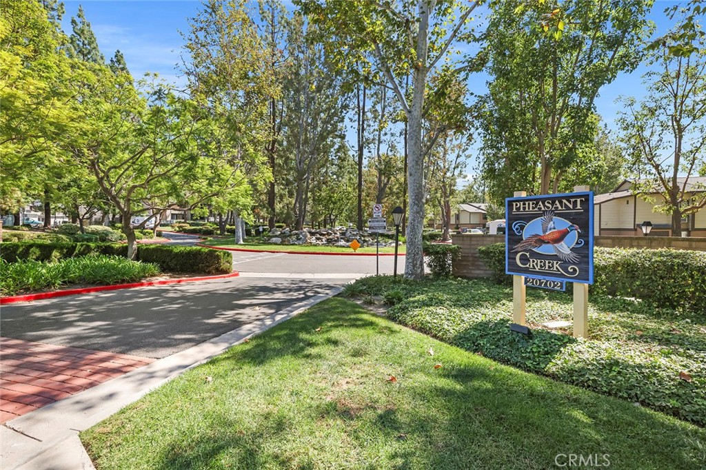 20702 El Toro Road, Unit 226 Lake Forest, CA 92630 - Photo 20 of 39 a sign board with yard in the back