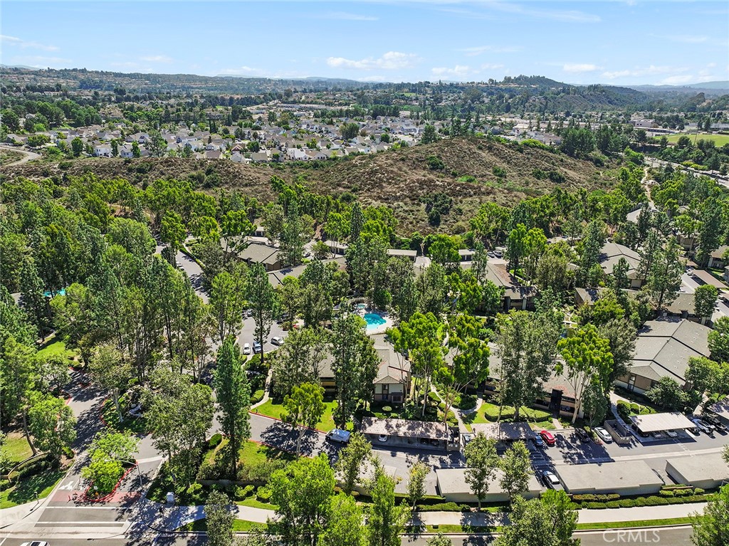20702 El Toro Road, Unit 226 Lake Forest, CA 92630 - Photo 27 of 39 an aerial view of residential houses with outdoor space and trees