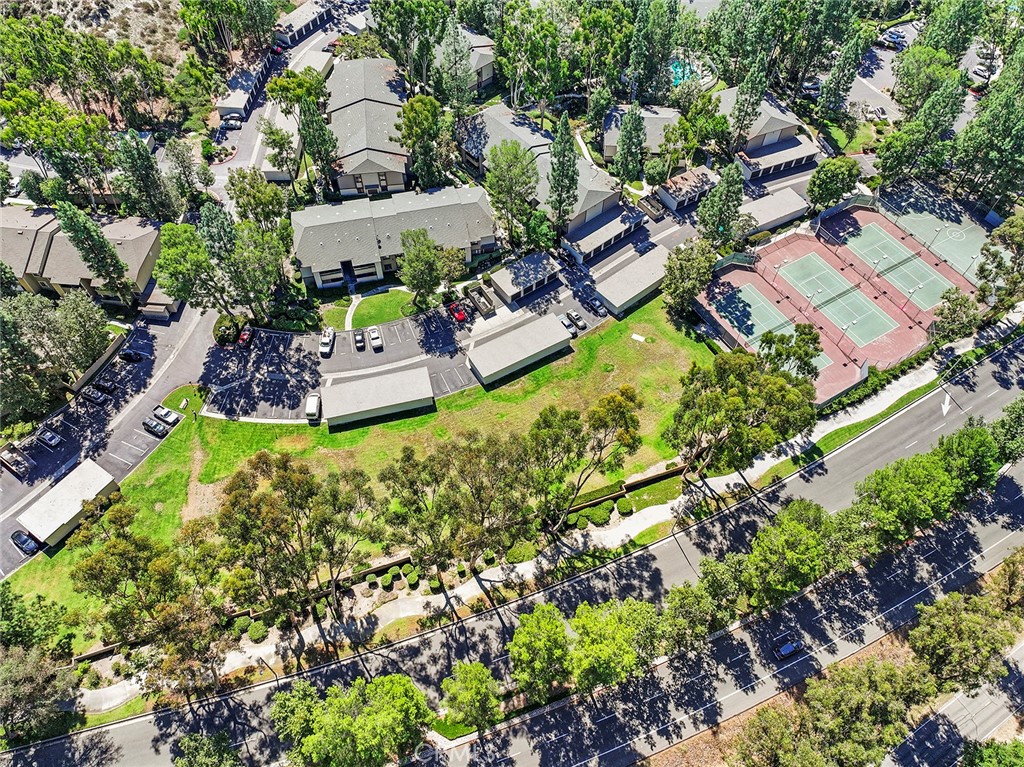 20702 El Toro Road, Unit 226 Lake Forest, CA 92630 - Photo 29 of 39 an aerial view of a house with a garden and lake view