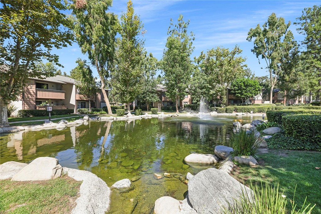 20702 El Toro Road, Unit 226 Lake Forest, CA 92630 - Photo 31 of 39 a view of a lake with couches chairs and a table of the ocean