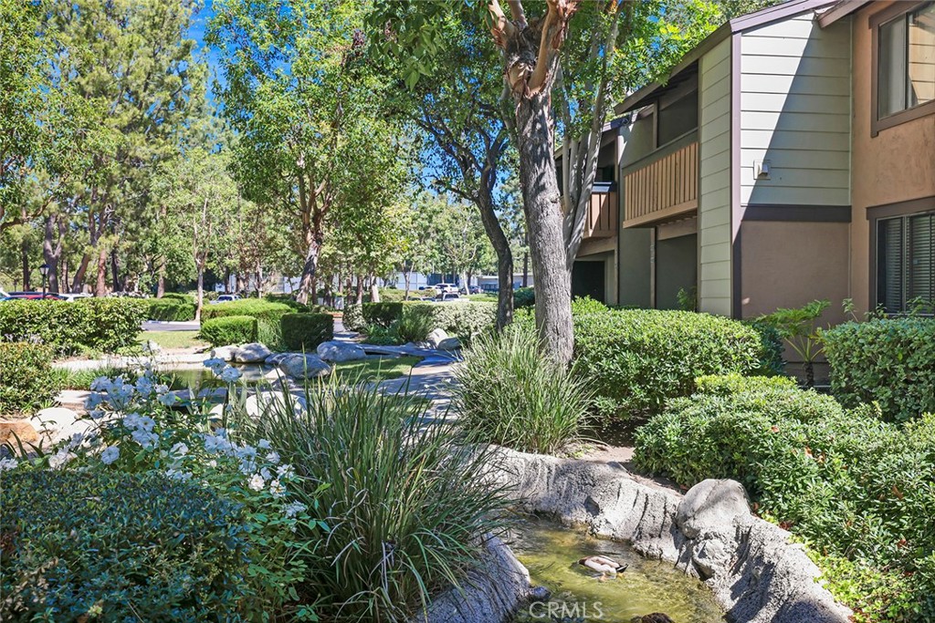 20702 El Toro Road, Unit 226 Lake Forest, CA 92630 - Photo 32 of 39 a view of backyard of house with outdoor seating and green space