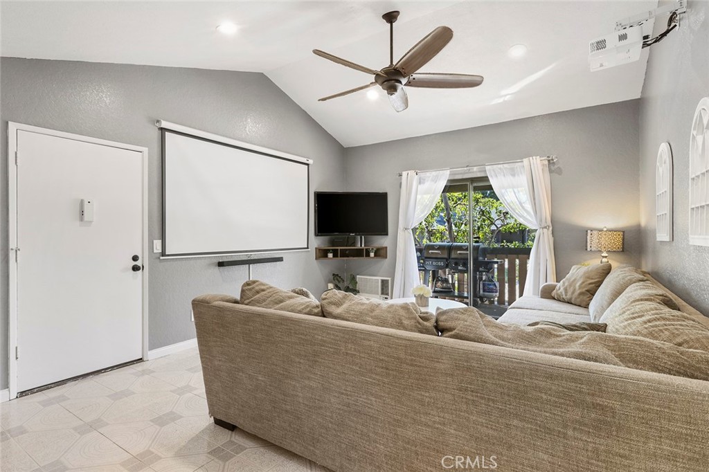 20702 El Toro Road, Unit 226 Lake Forest, CA 92630 - Photo 6 of 39 a living room with furniture and a flat screen tv