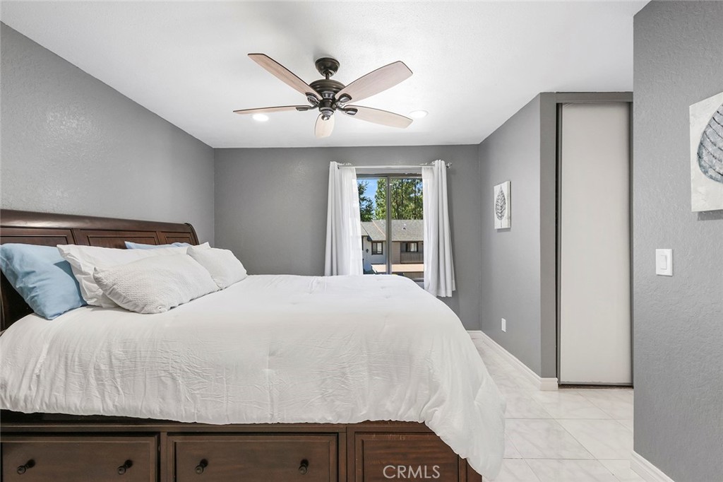 20702 El Toro Road, Unit 226 Lake Forest, CA 92630 - Photo 10 of 39 a bedroom with a large bed and a chandelier