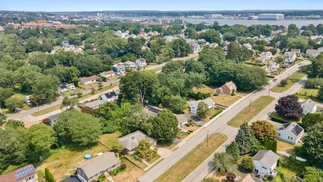 an aerial view of residential houses with outdoor space