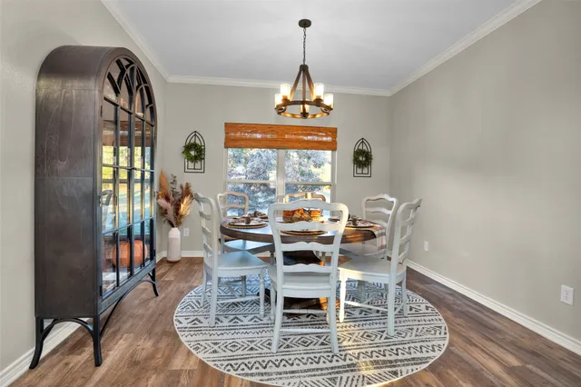 a workspace with wooden floor and a window