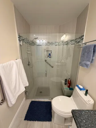 a living room with furniture fireplace and a window