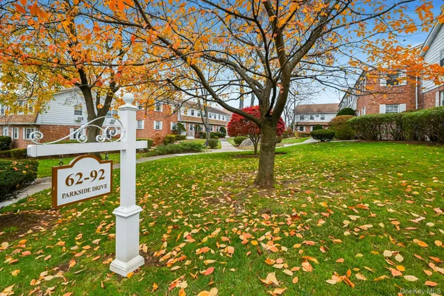 a sign broad in front of a brick building