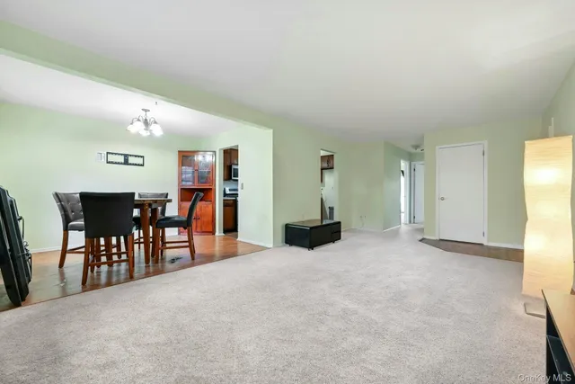 a view of a livingroom with furniture and a window