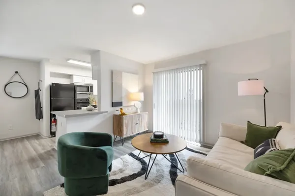 a bedroom with a bed and a potted plant
