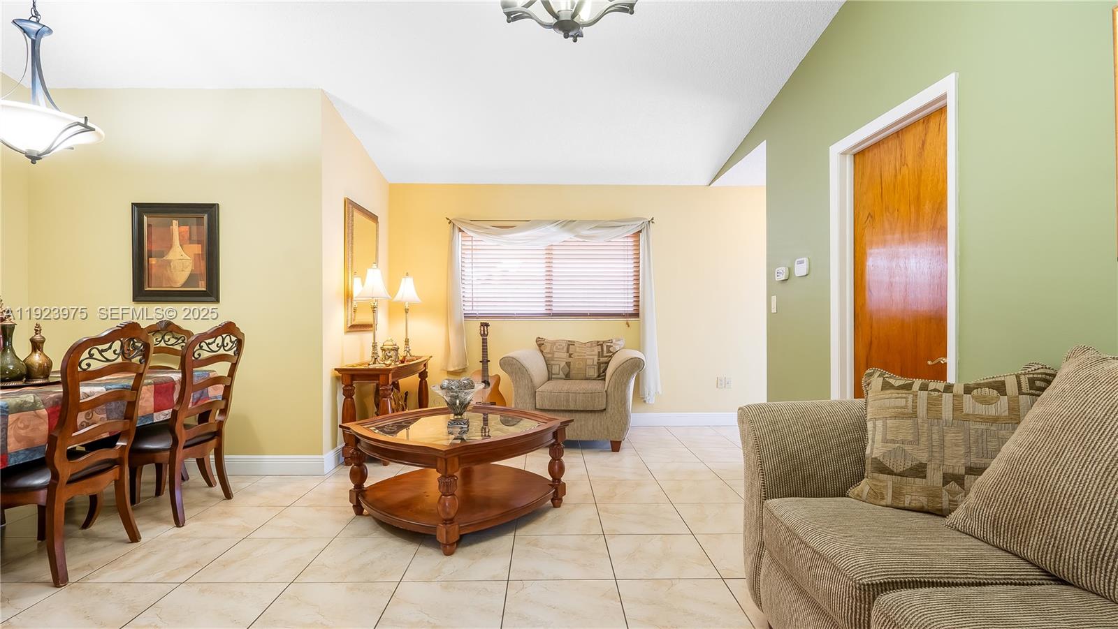 2549 West 72nd Place Hialeah, FL 33016 - Photo 12 of 46 a living room with furniture and a window
