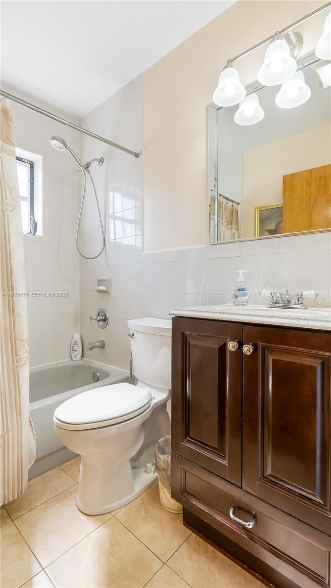 2549 West 72nd Place Hialeah, FL 33016 - Photo 21 of 46 a bathroom with a sink toilet and shower