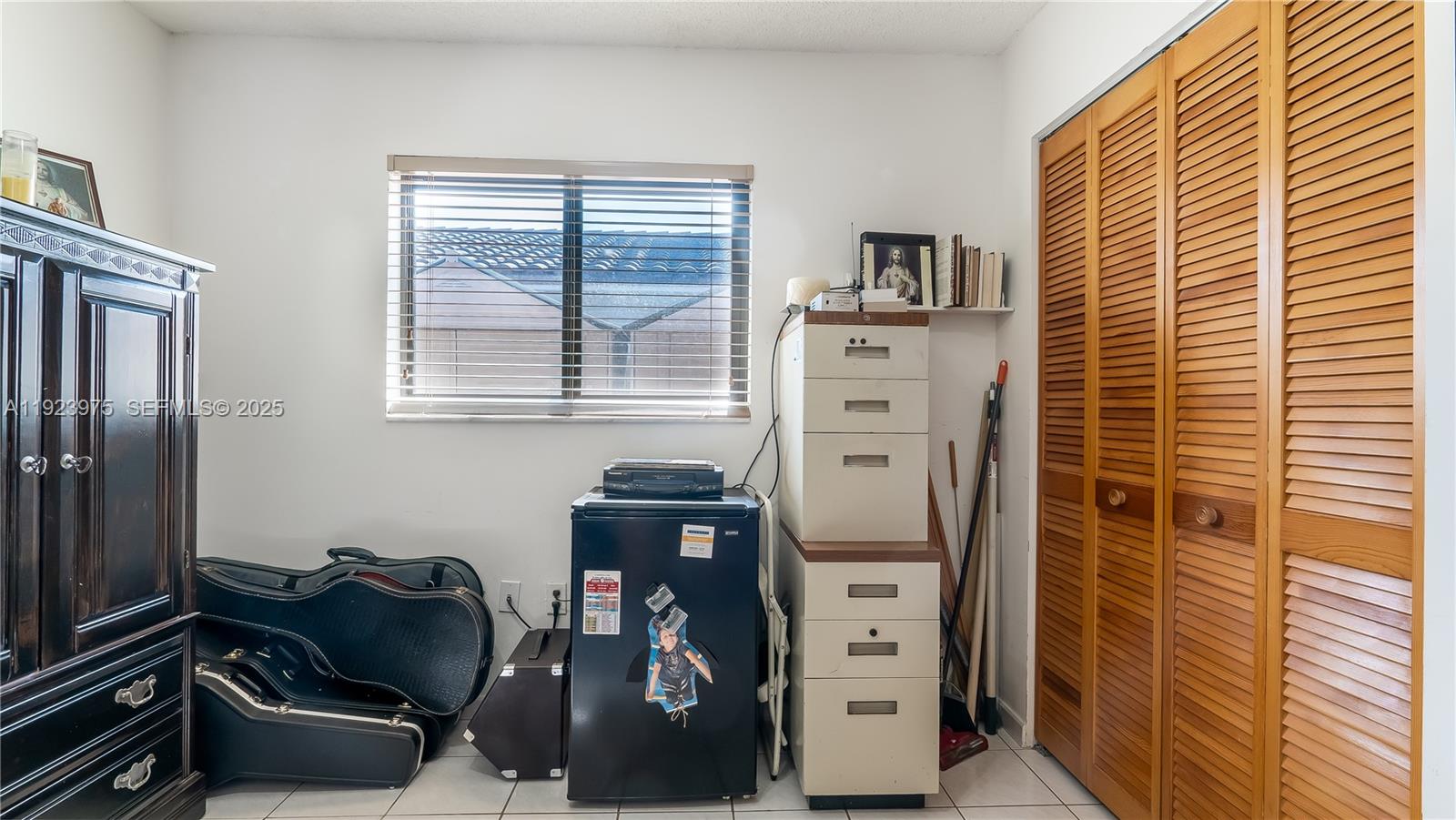 2549 West 72nd Place Hialeah, FL 33016 - Photo 22 of 46 a room with storage and utility