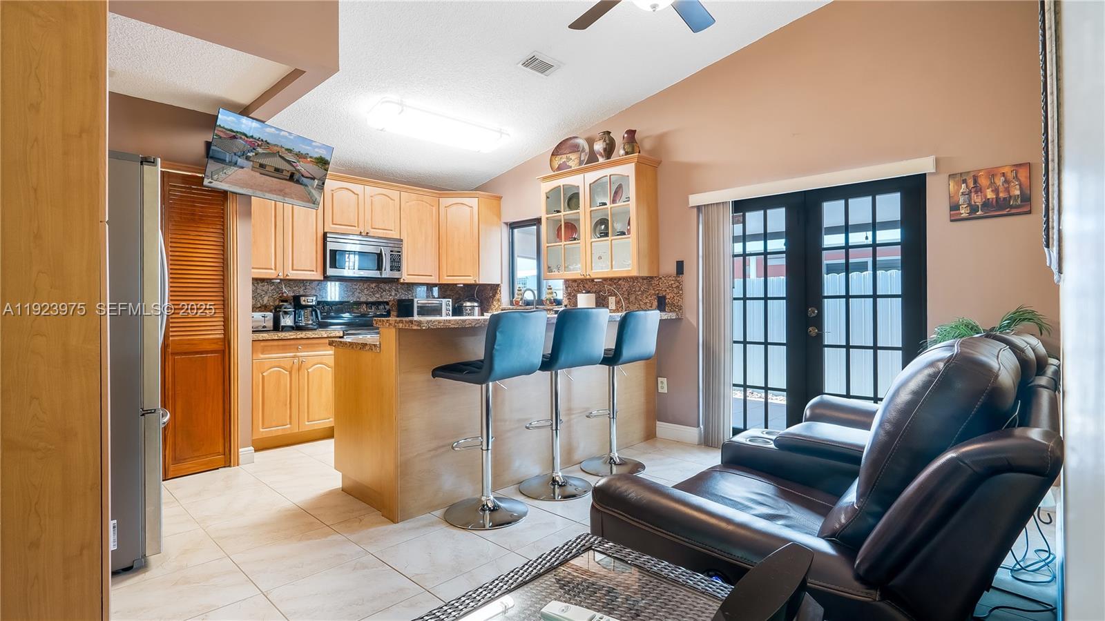 2549 West 72nd Place Hialeah, FL 33016 - Photo 24 of 46 a living room with furniture and a window