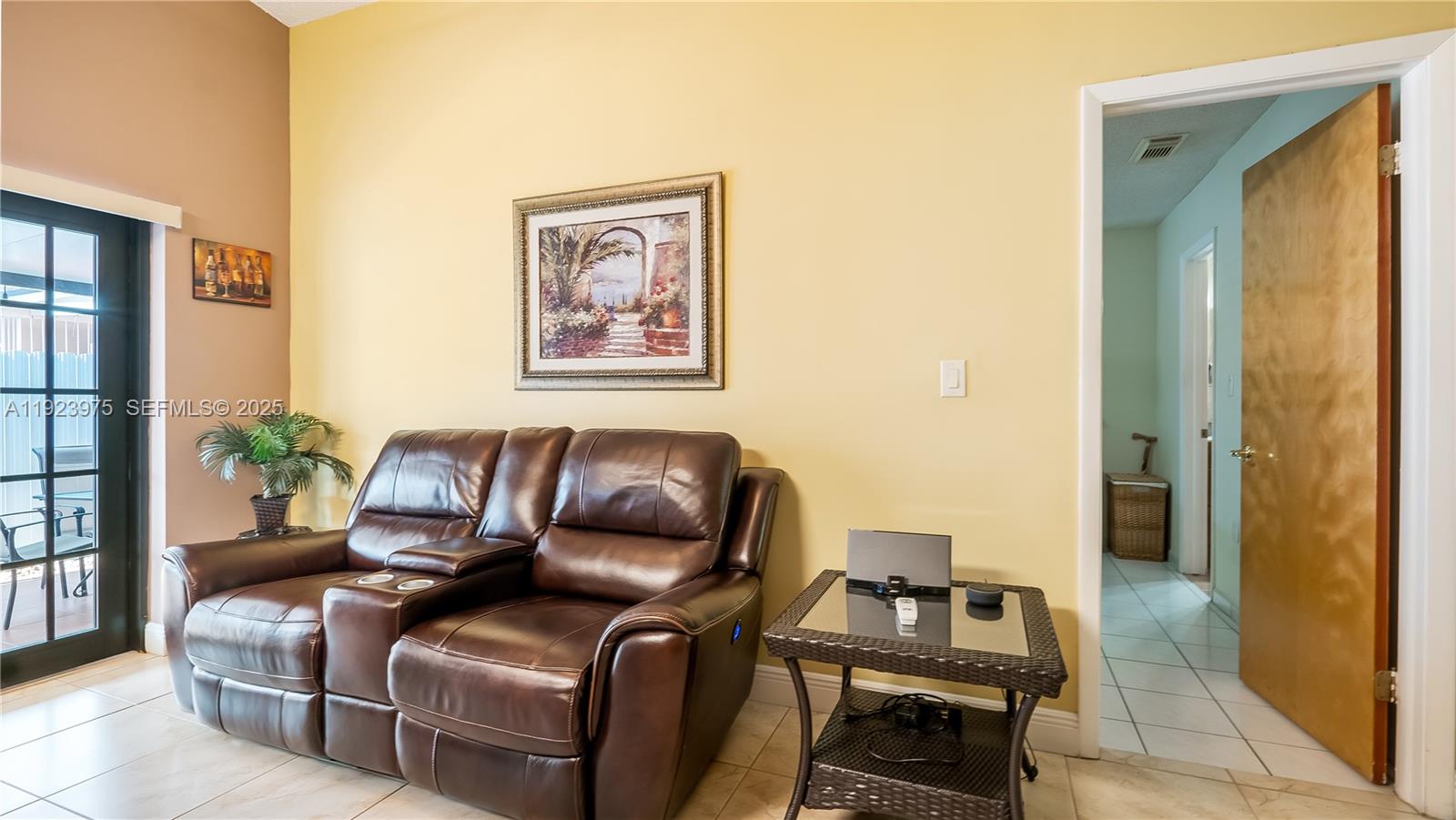 2549 West 72nd Place Hialeah, FL 33016 - Photo 29 of 46 a living room with furniture and a window