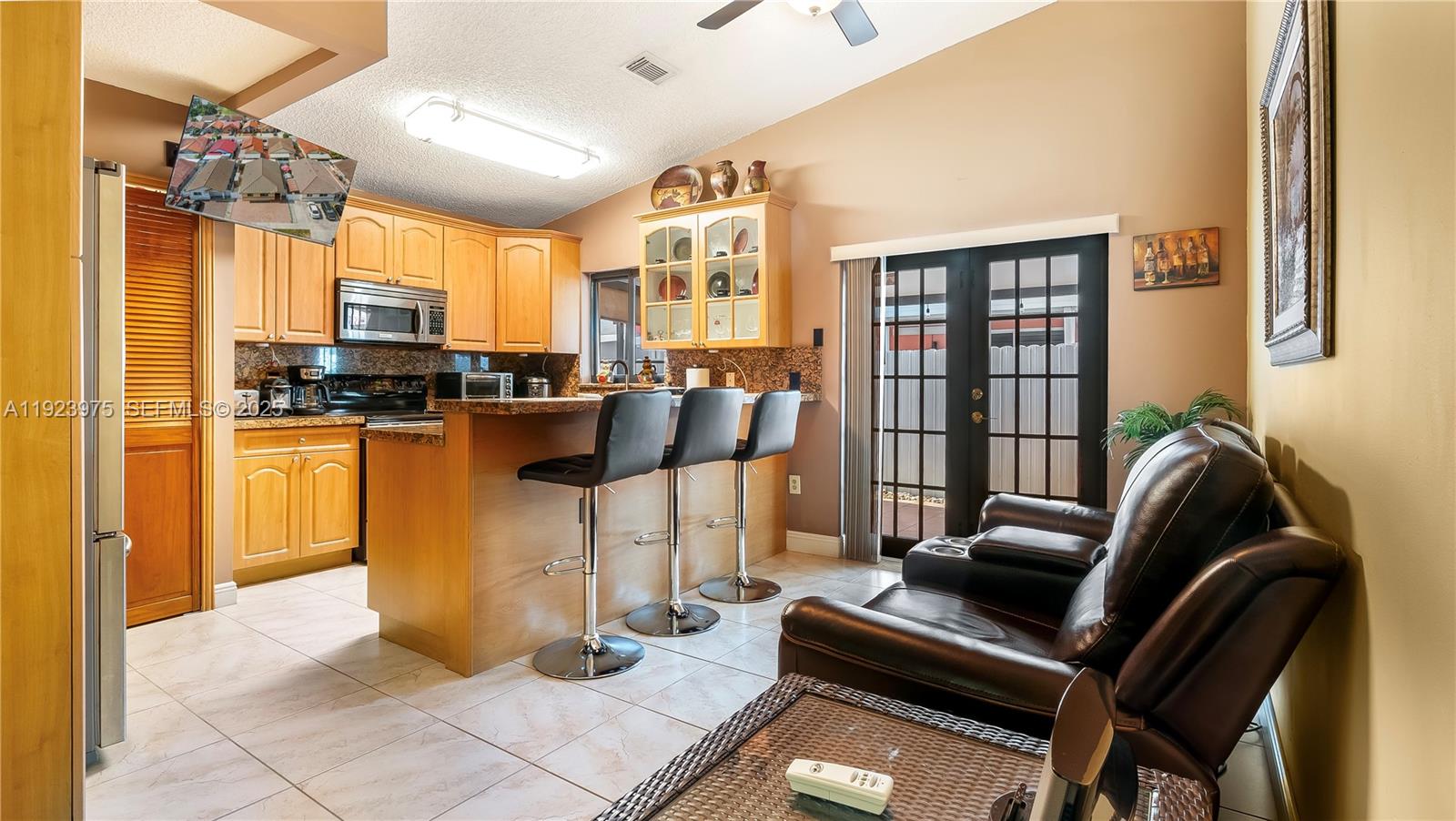 2549 West 72nd Place Hialeah, FL 33016 - Photo 30 of 46 a view of a livingroom with furniture and a window