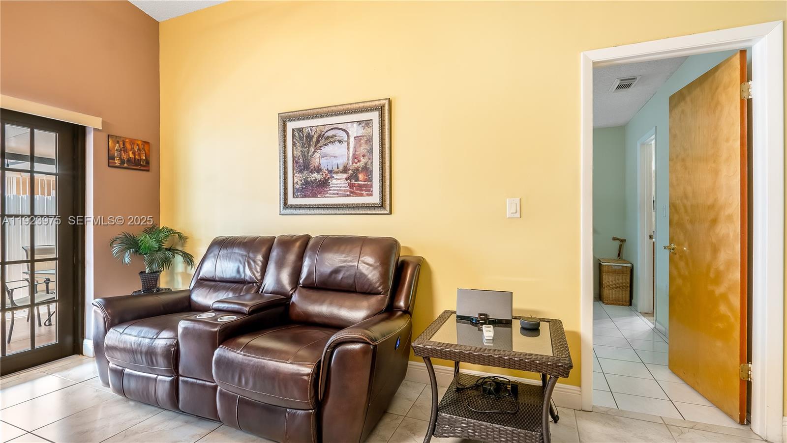 2549 West 72nd Place Hialeah, FL 33016 - Photo 32 of 46 a living room with furniture and a window
