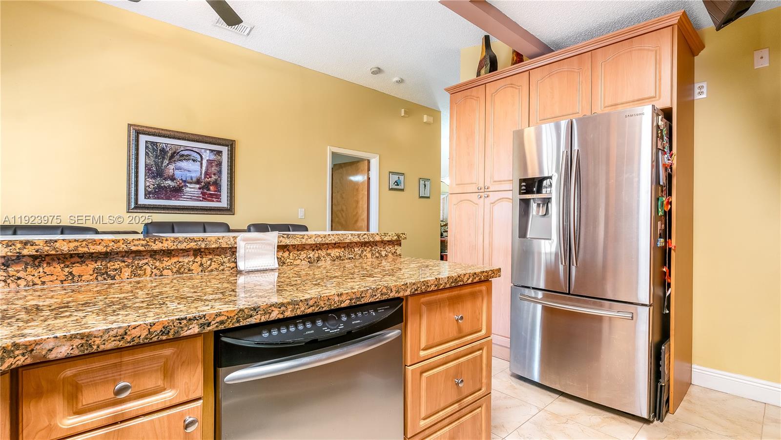 2549 West 72nd Place Hialeah, FL 33016 - Photo 33 of 46 a kitchen with stainless steel appliances granite countertop a refrigerator and a sink