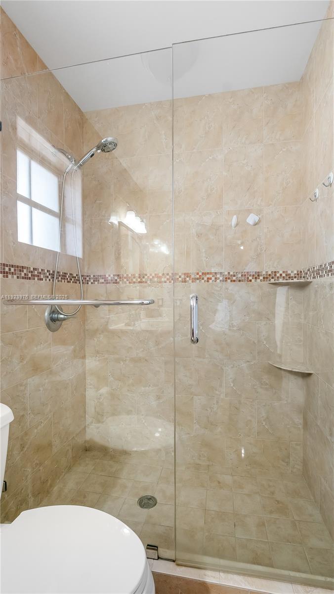 2549 West 72nd Place Hialeah, FL 33016 - Photo 38 of 46 a bathroom with a toilet and a shower