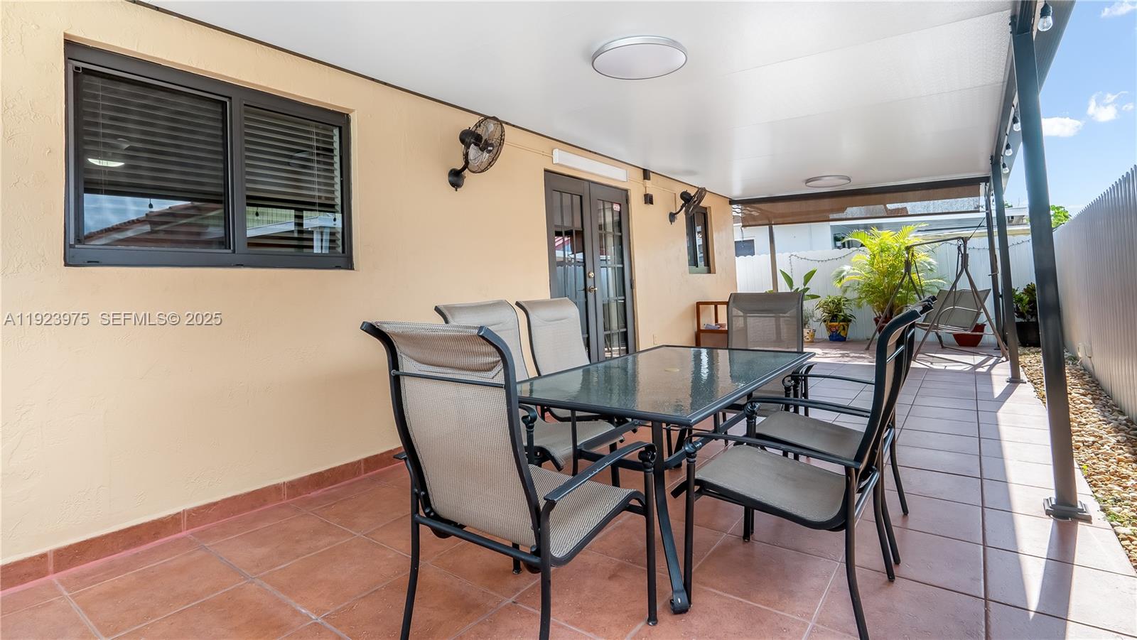 2549 West 72nd Place Hialeah, FL 33016 - Photo 40 of 46 a view of a dining room with furniture window and outside view