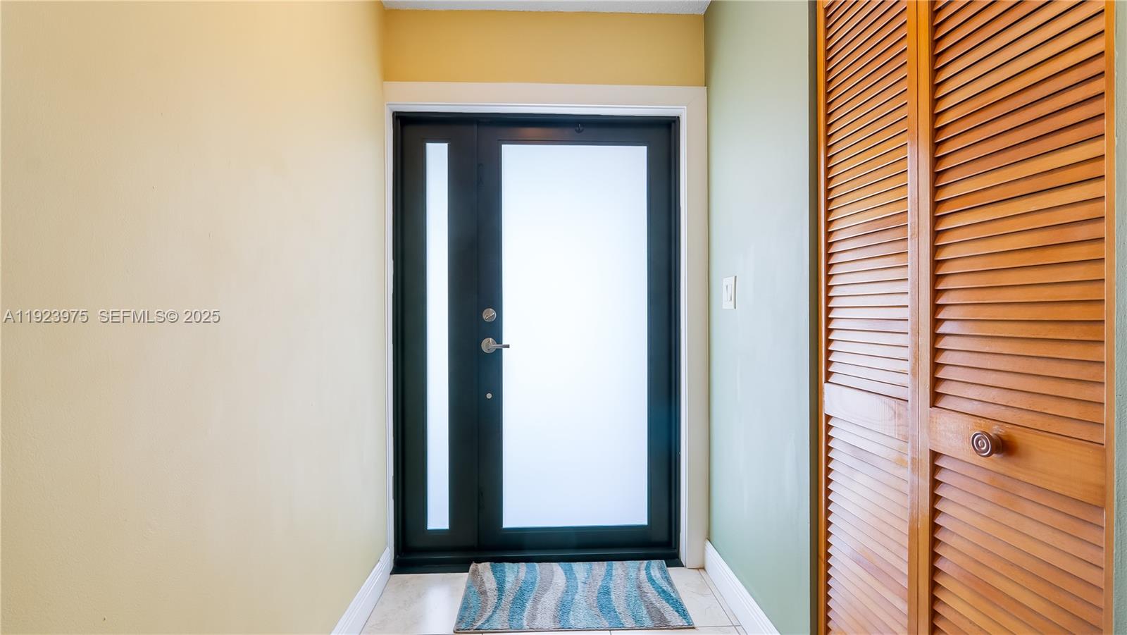 2549 West 72nd Place Hialeah, FL 33016 - Photo 8 of 46 a view of front door of a house