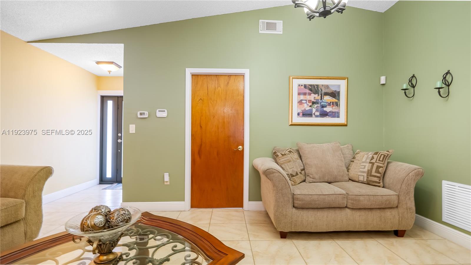 2549 West 72nd Place Hialeah, FL 33016 - Photo 10 of 46 a living room with furniture and wooden floor