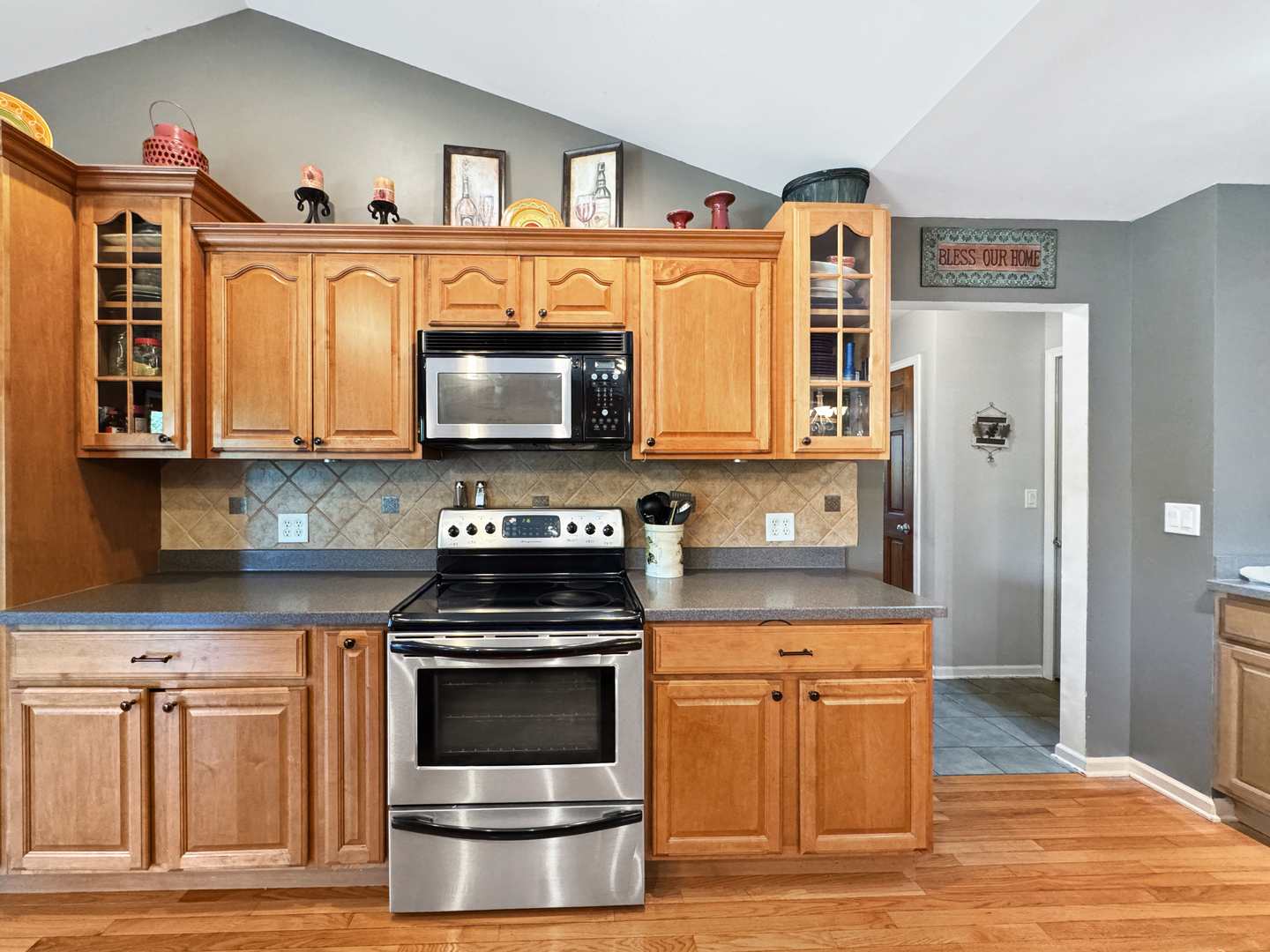 1063 Deer Valley Drive Varna, IL 61375 - Photo 14 of 87 a kitchen with stainless steel appliances granite countertop a stove a sink and a microwave