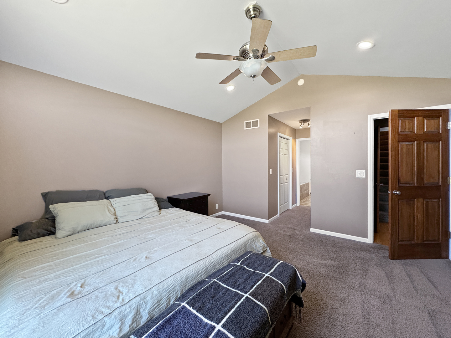 1063 Deer Valley Drive Varna, IL 61375 - Photo 23 of 87 a bedroom with a large bed and a chandelier