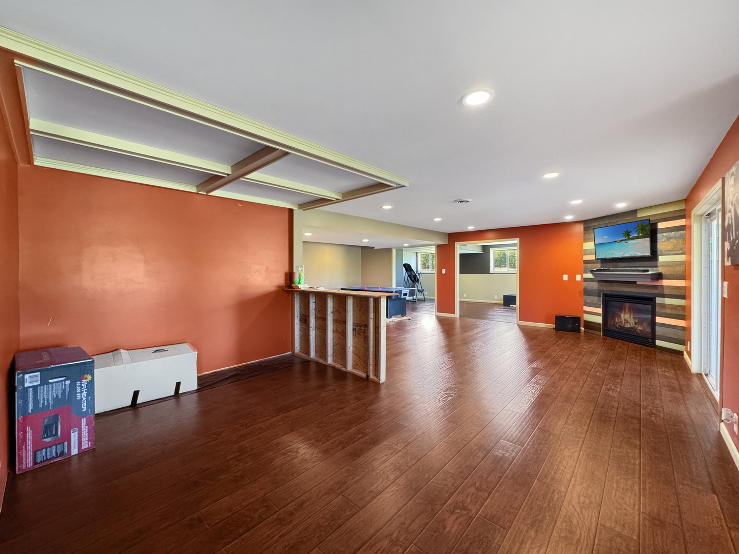 1063 Deer Valley Drive Varna, IL 61375 - Photo 36 of 87 a view of a livingroom with furniture and an empty room with wooden floor