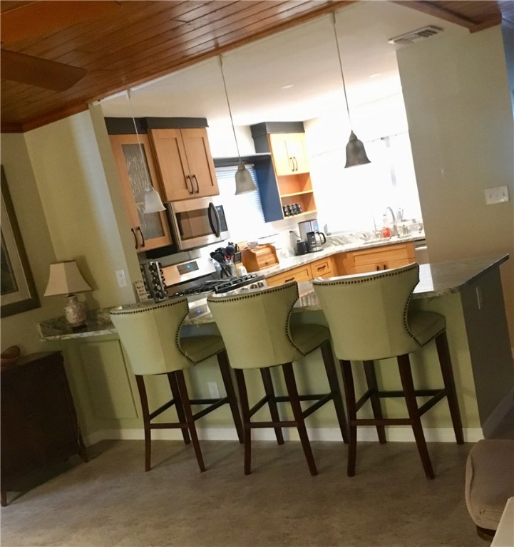 9605 Riverview Drive Micco, FL 32976 - Photo 11 of 36 a room with chairs and a table