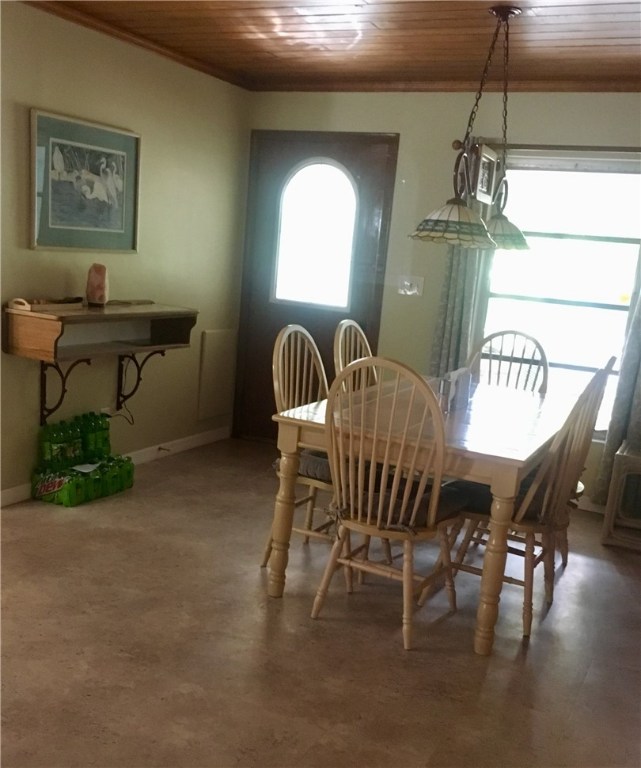 9605 Riverview Drive Micco, FL 32976 - Photo 16 of 36 a dining room with furniture and window