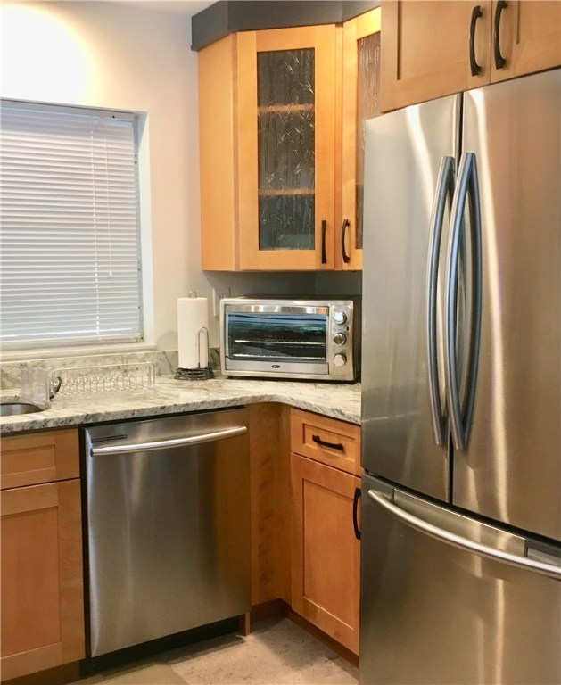 9605 Riverview Drive Micco, FL 32976 - Photo 20 of 36 a kitchen with stainless steel appliances granite countertop a refrigerator and a sink