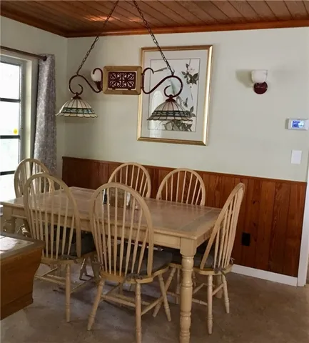 a building outdoor space with patio furniture and potted plants