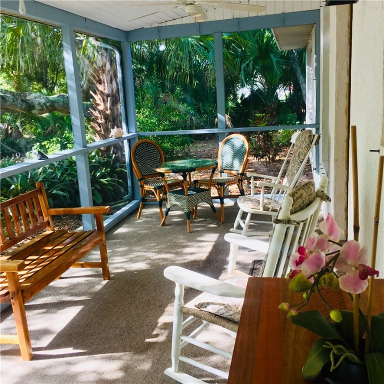 9605 Riverview Drive Micco, FL 32976 - Photo 23 of 36 a building outdoor space with patio furniture and potted plants