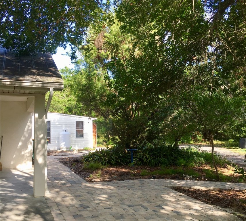 9605 Riverview Drive Micco, FL 32976 - Photo 24 of 36 a front view of a house with a yard