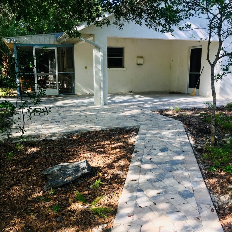 9605 Riverview Drive Micco, FL 32976 - Photo 26 of 36 a view of a house with a patio